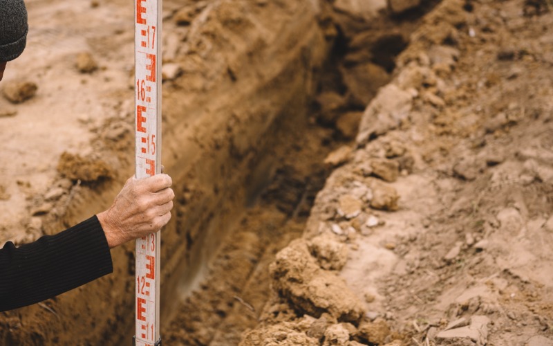 measuring irrigation trench